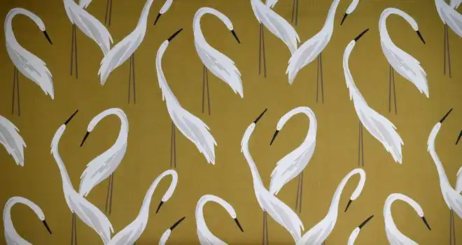 Swan-patterned wallpaper in one of the sitting rooms.