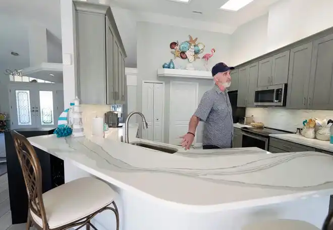 Joe Larson of Larson Construction Management shows a recent remodel in Port Orange, Wednesday, Feb. 28, 2024.