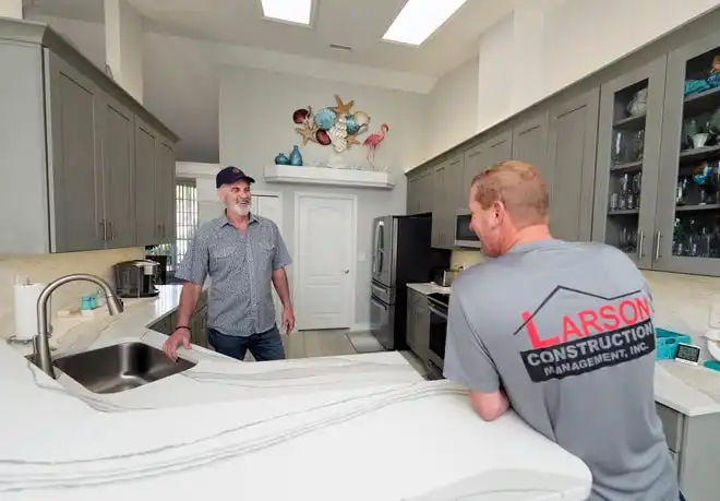 Joe Larson and David Fox of Larson Construction Management shows a recent remodel in Port Orange, Wednesday, Feb. 28, 2024.