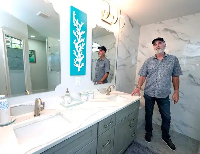 Joe Larson of Larson Construction Management shows a recent remodel in Port Orange, Wednesday, Feb. 28, 2024.