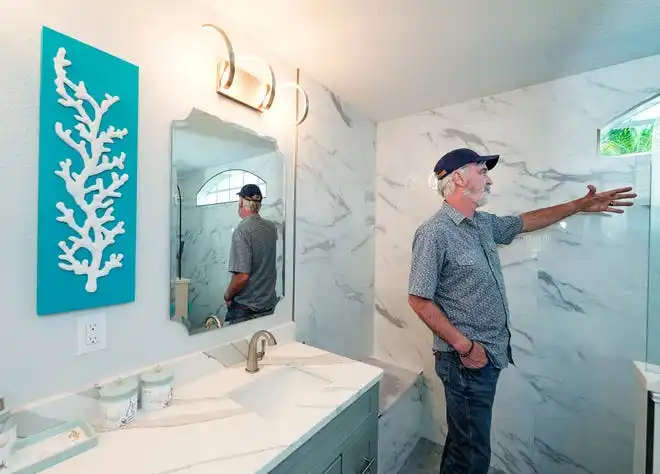 Joe Larson of Larson Construction Management shows a recent remodel in Port Orange, Wednesday, Feb. 28, 2024.