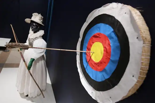 An 1820s archery ensemble. The newest exhibit at The Cummer Museum of Art and Gardens, Sporting Fashion: Outdoor Girls 1800 to 1960 opened Wednesday, February 28, 2024. The exhibit is made up of 65 ensembles of women's clothing and other related accessories designed, starting in the early 1900s to simply allow women to get outside to walk and garden and as more opportunities opened up, more activity specific clothing was designed with Western cultural expectations taken into account. The exhibit was organized by the American Federation of the Arts and FIDM Museum of the Fashion Institute of Design & Merchandising in Los Angeles.