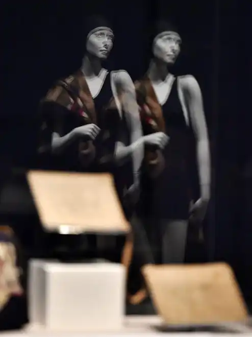 A double reflection of a mannequin wearing swimwear from the 1920s is reflected in a display case with other artifacts. The newest exhibit at The Cummer Museum of Art and Gardens, Sporting Fashion: Outdoor Girls 1800 to 1960 opened Wednesday, February 28, 2024. The exhibit is made up of 65 ensembles of women's clothing and other related accessories designed, starting in the early 1900s to simply allow women to get outside to walk and garden and as more opportunities opened up, more activity specific clothing was designed with Western cultural expectations taken into account. The exhibit was organized by the American Federation of the Arts and FIDM Museum of the Fashion Institute of Design & Merchandising in Los Angeles.