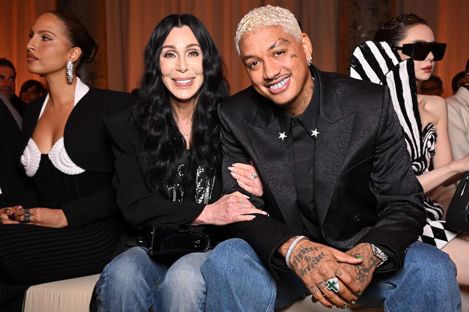 Cher and Alexander ‘AE’ Edwards Bring Their Love to the Balmain Front Row in Coordinating Outfits