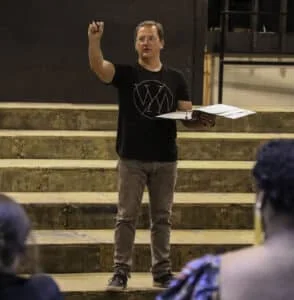 Dr. Nick Ewen directs students during rehearsal for Poor Clare