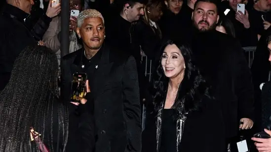 Alexander Edwards and Cher arrive for the presentation of creations by Balmain for the Women Ready-to-wear Fall-Winter 2024/2025 collection as part of the Paris Fashion Week, in Paris on February 28, 2024 (Photo by Miguel MEDINA / AFP)(AFP)