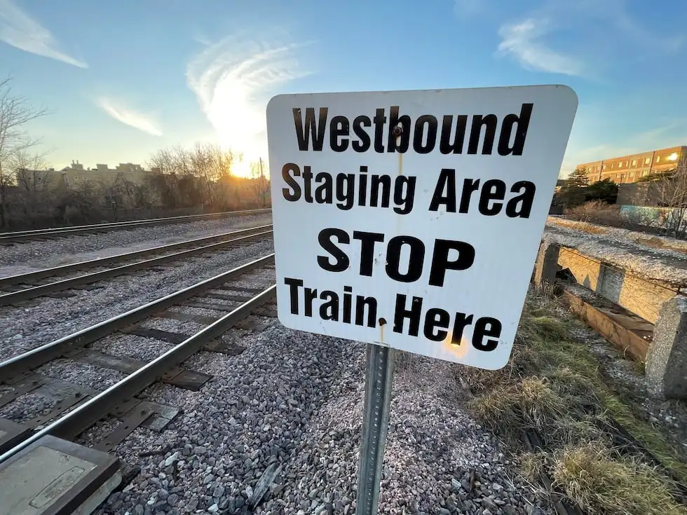 A small white sign on the tracks in Forest Park, Illinois that is difficult for members of the...