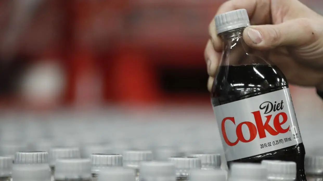 coca cola predicts drop in profit this year