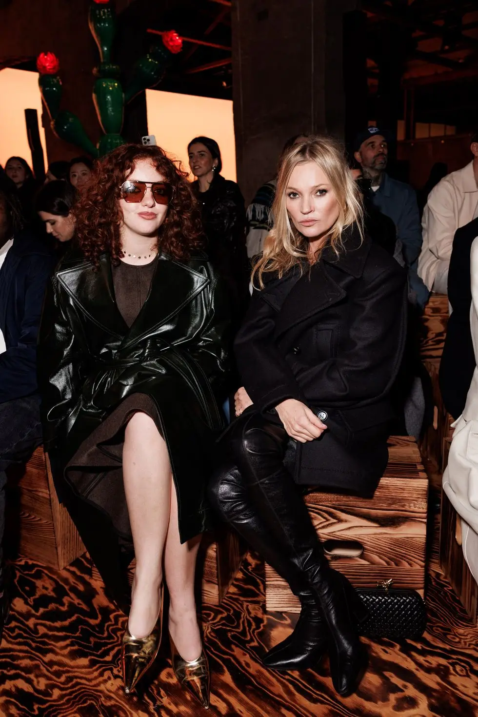 two women sitting on a chair