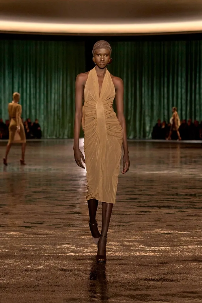 A model wears a diaphonous halter-neck dress