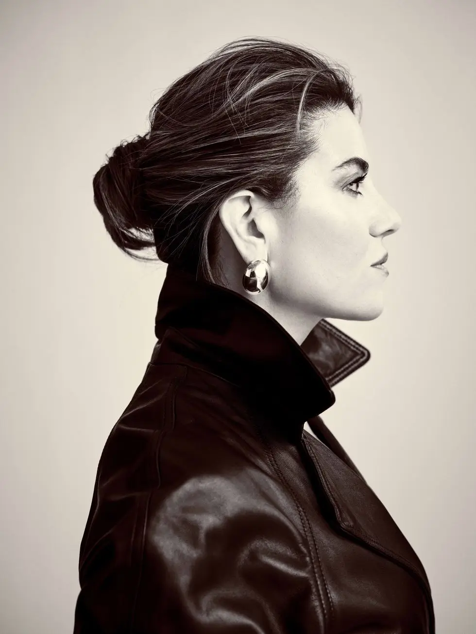 a brunette woman in profile