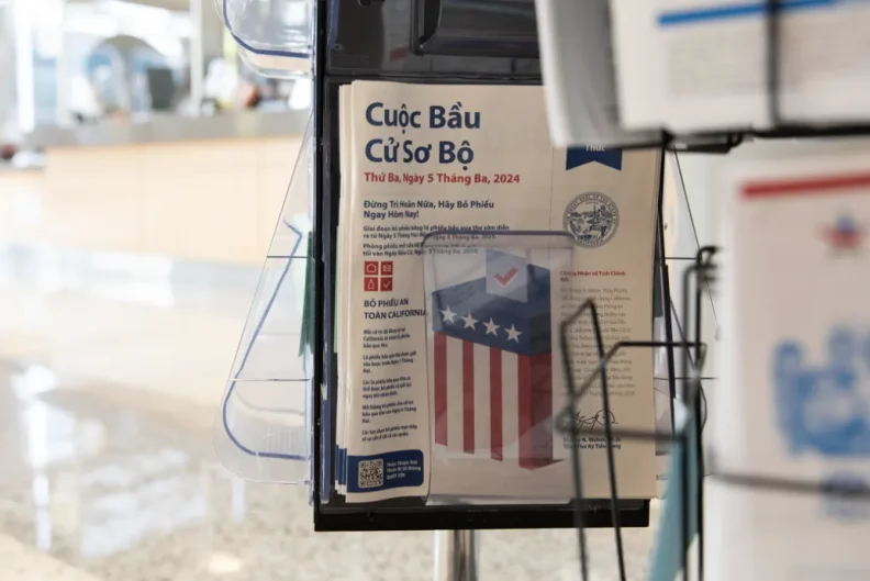 A packet of voting material written in Vietnamese sits in a rack at the San Diego Registrar of Voters.