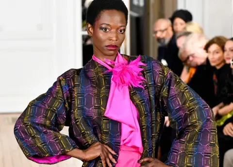 Shutterstock A model walks the runway during the Imane Ayissi Haute Couture Spring/Summer 2024 at Paris Fashion Week in January 2024