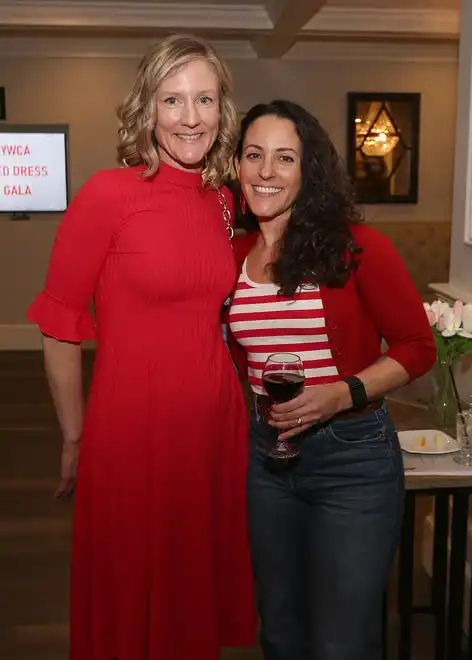 Angela Corrieri Johnson and Lara Harrington enjoy the evening at the YWCA 21st Annual Red Dress Fashion Show held Thursday, February 29, 2024 at the Century House in Acushnet.