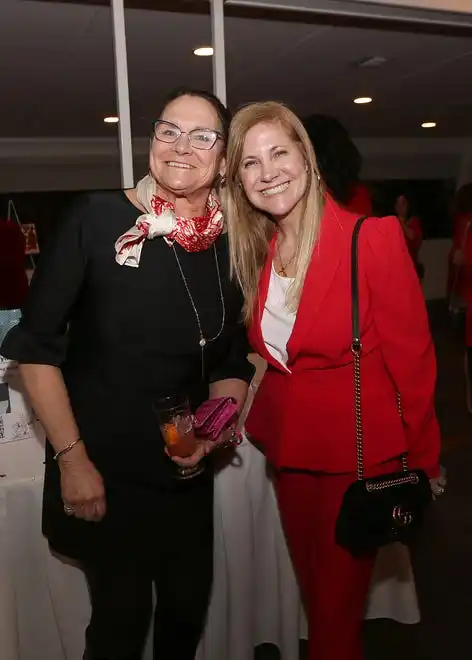 Jill Pitman and Caroline Arsenault enjoy the evening at the YWCA 21st Annual Red Dress Fashion Show held Thursday, February 29, 2024 at the Century House in Acushnet.