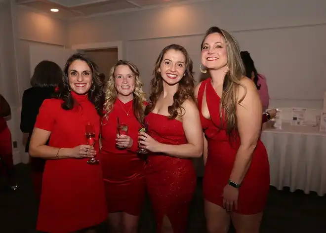 Jessica Noy, Kathleen Long, Savannah Marcelino and Jessica Costa enjoy the evening at the YWCA 21st Annual Red Dress Fashion Show held Thursday, February 29, 2024 at the Century House in Acushnet.