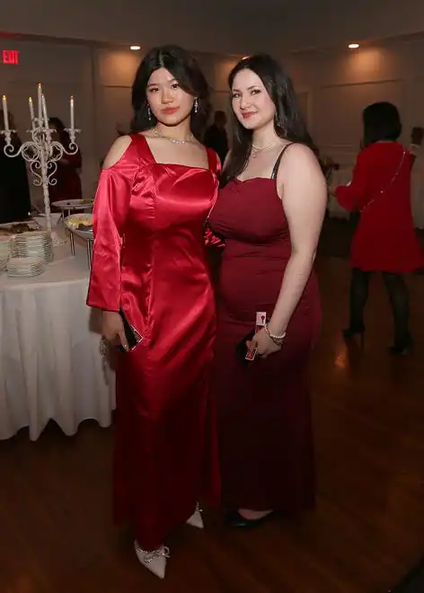 Janice Wang and Hannah Pittsley enjoy the evening at the YWCA 21st Annual Red Dress Fashion Show held Thursday, February 29, 2024 at the Century House in Acushnet.