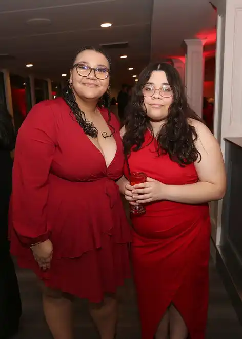 Jazzy Roldan and Nevaeh Tucker enjoy the evening at the YWCA 21st Annual Red Dress Fashion Show held Thursday, February 29, 2024 at the Century House in Acushnet.