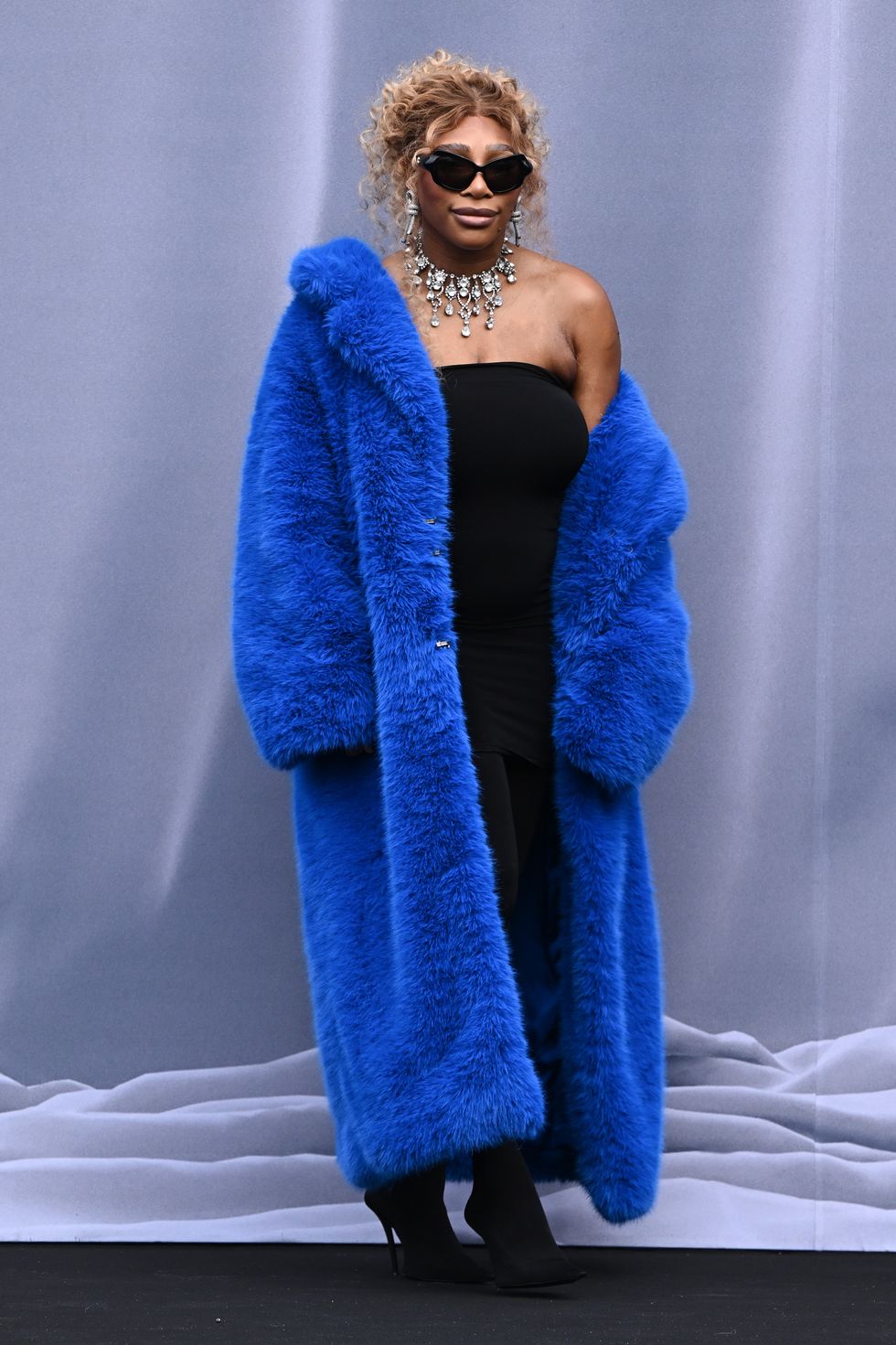 Serena Williams looks glamorous in a blue statement coat