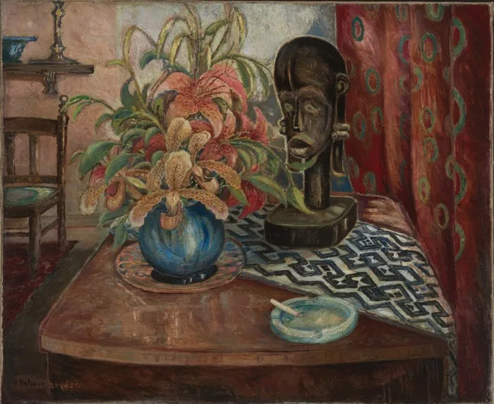 Still-life painting of flowers in blue spherical vase on table with a cigarette in an ashtray and a black mask on a plinth