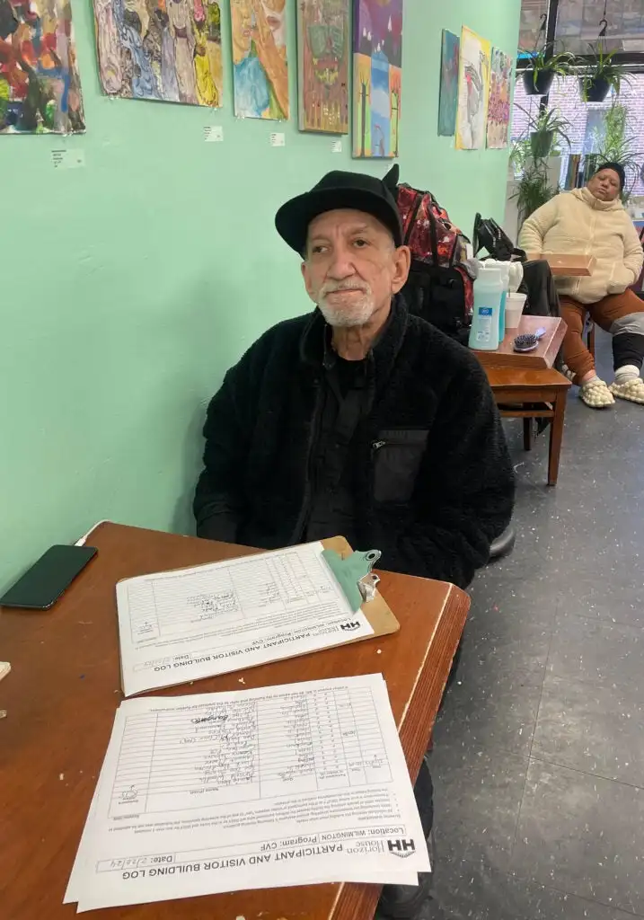 Ken Segal sits at a table