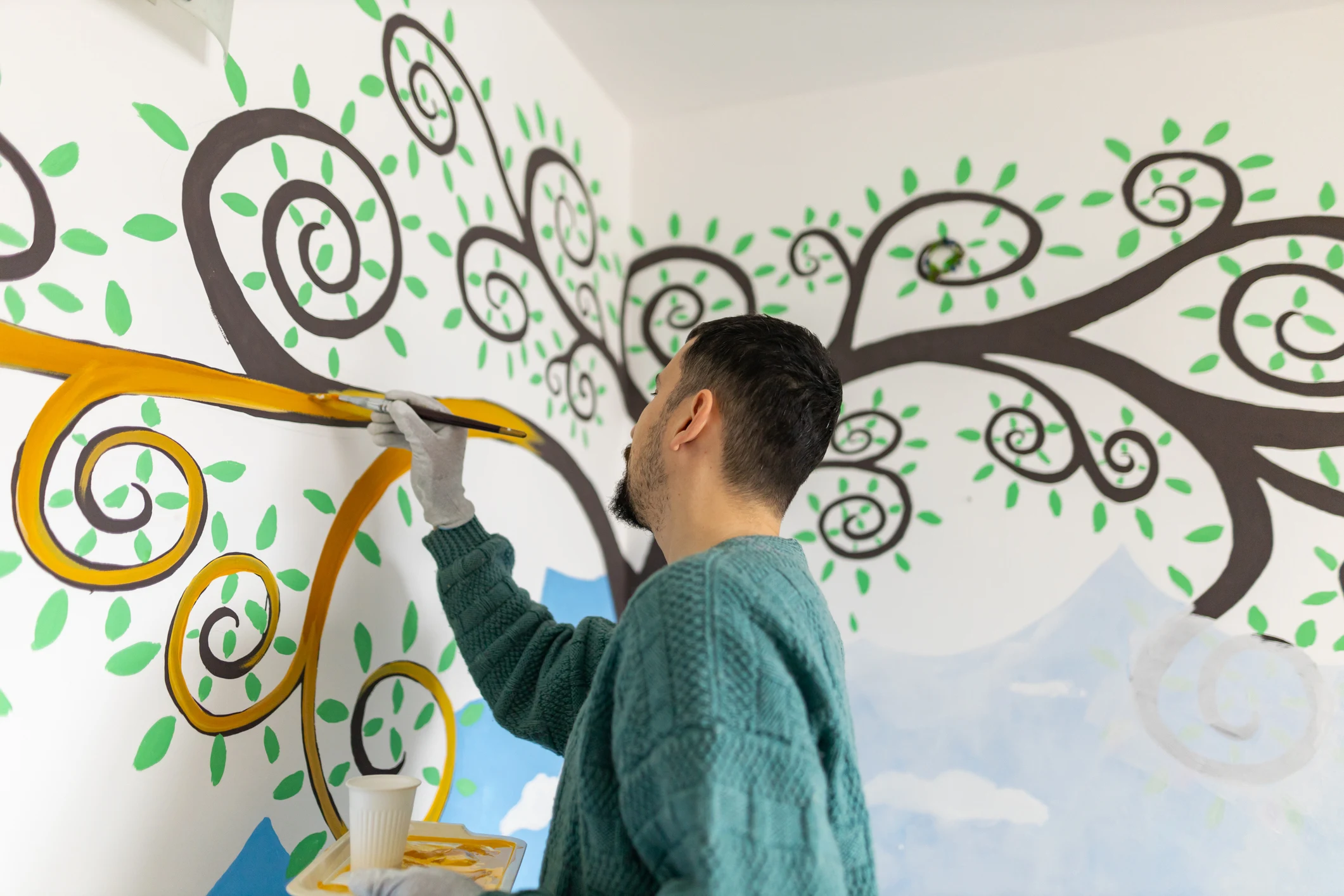 Stop using wall stickers and paint a mural instead