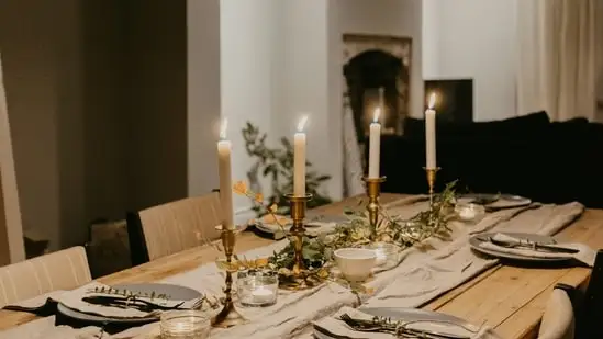 Ramadan-themed Table Settings: Set your dining table with themed placemats, napkin rings, and candles in warm hues to elevate the dining experience during Suhoor and Iftar.(Unsplash)