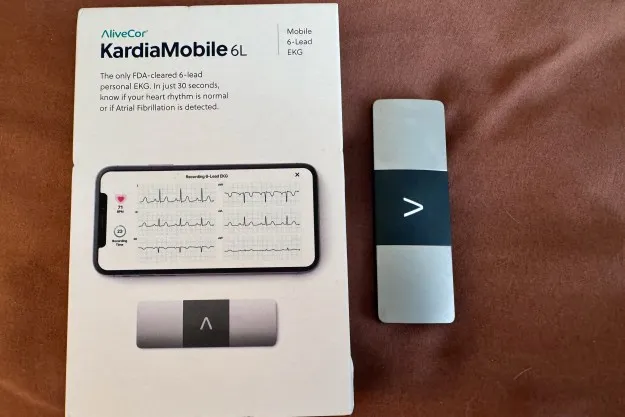 A KardioMobile 6L device next to its box.