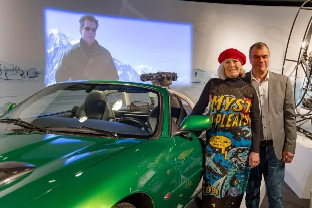 Meg Simmonds, archive director for Eon Productions, and Chris Corbould, special effects supervisor/director, stand next to the Jaguar XKR from Die Another Day inside the new James Bond exhibit, 007 Science, on March 5, 2024, at the Museum of Science and Industry. (Brian Cassella/Chicago Tribune)