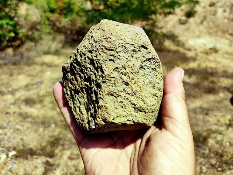 Close up view of a stone tool possibly from Layer VII at Korolevo I.