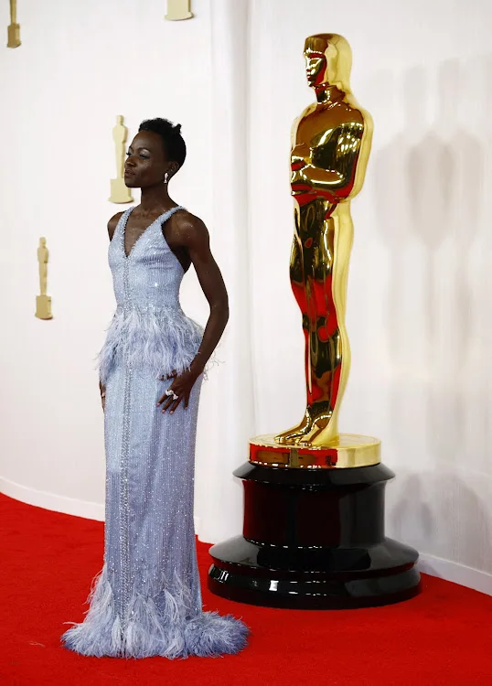 Lupita Nyong'o poses on the red carpet during the Oscars arrivals at the 96th Academy Awards in Hollywood, Los Angeles.