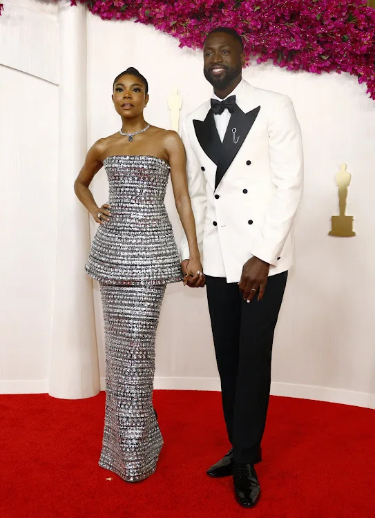 Gabrielle Union and Dwyane Wade pose on the red carpet during the Oscars arrivals at the 96th Academy Awards in Hollywood, Los Angeles.