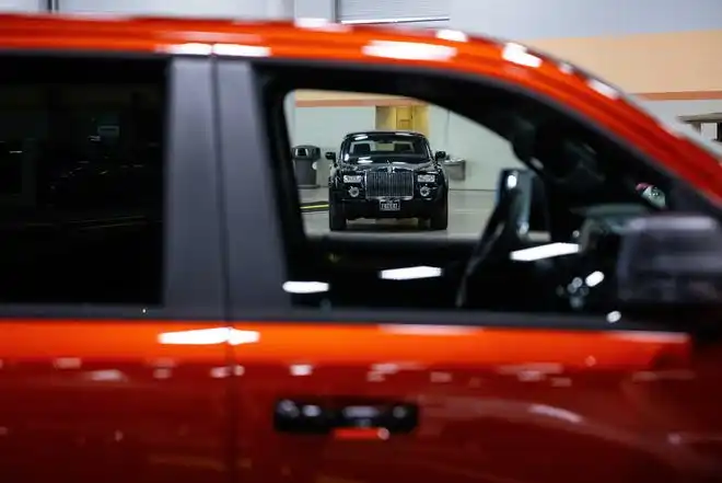 Vehicles from more than a dozen manufacturers sit on the event center floor during set up for the All Iowa Auto Show Thursday, March 14, 2024, at the Iowa Events Center.