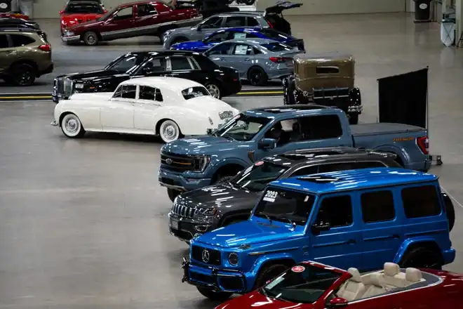 Vehicles from more than a dozen manufacturers sit on the event center floor during set up for the All Iowa Auto Show Thursday, March 14, 2024, at the Iowa Events Center.