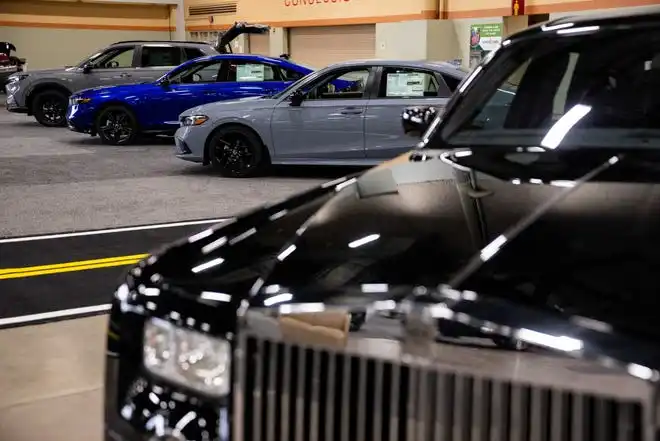 Vehicles from more than a dozen manufacturers sit on the event center floor during set up for the All Iowa Auto Show Thursday, March 14, 2024, at the Iowa Events Center.