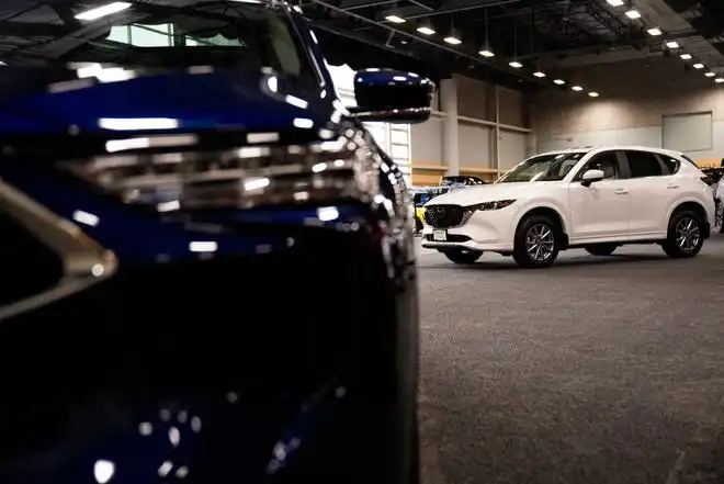 SUVs from Mazda sit during the set up for the 2024 All Iowa Auto Show Thursday, March 14, 2024, at the Iowa Events Center.