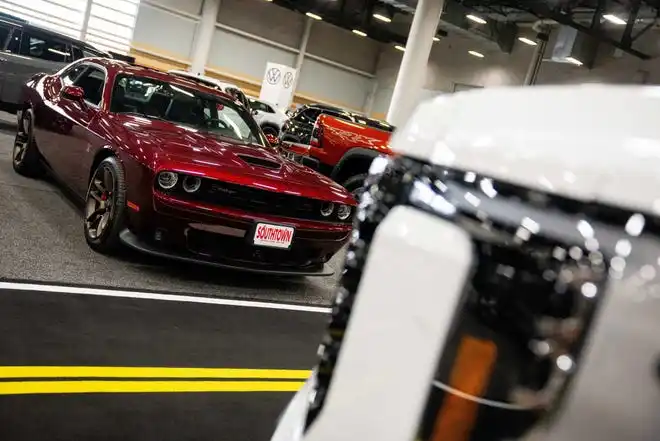 Vehicles from more than a dozen manufacturers sit on the event center floor during set up for the All Iowa Auto Show Thursday, March 14, 2024, at the Iowa Events Center.