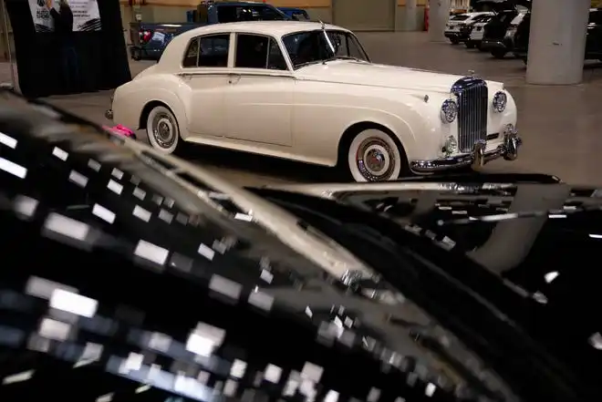 Vehicles from more than a dozen manufacturers sit on the event center floor during set up for the All Iowa Auto Show Thursday, March 14, 2024, at the Iowa Events Center.