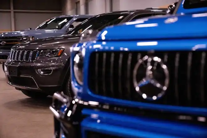 Vehicles from more than a dozen manufacturers sit on the event center floor during set up for the All Iowa Auto Show Thursday, March 14, 2024, at the Iowa Events Center.