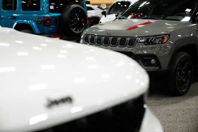 Vehicles from more than a dozen manufacturers sit on the event center floor during set up for the All Iowa Auto Show Thursday, March 14, 2024, at the Iowa Events Center.