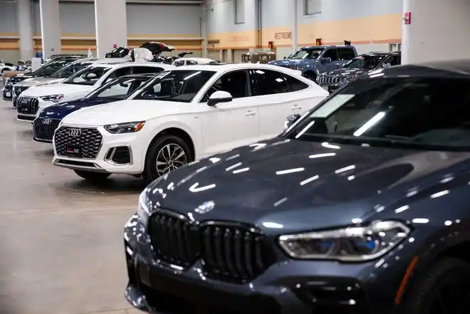 Vehicles from more than a dozen manufacturers sit on the event center floor during set up for the All Iowa Auto Show Thursday, March 14, 2024, at the Iowa Events Center.