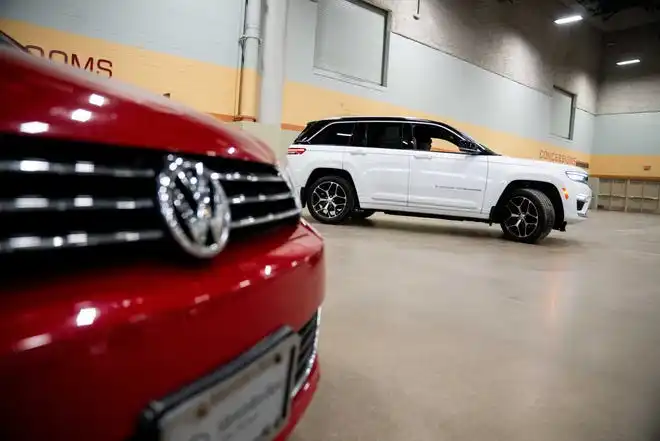 Vehicles from more than a dozen manufacturers sit on the event center floor during set up for the All Iowa Auto Show Thursday, March 14, 2024, at the Iowa Events Center.