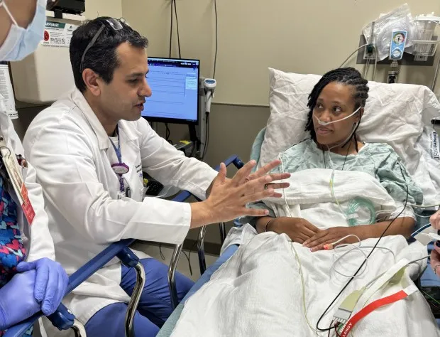 Shaunté Brewer talks with Dr. Sunil Pauwaa during her annual cardiac angiography at Advocate Christ Medical Center in Oak Lawn on Feb. 21, 2024. (EJ Brewer)