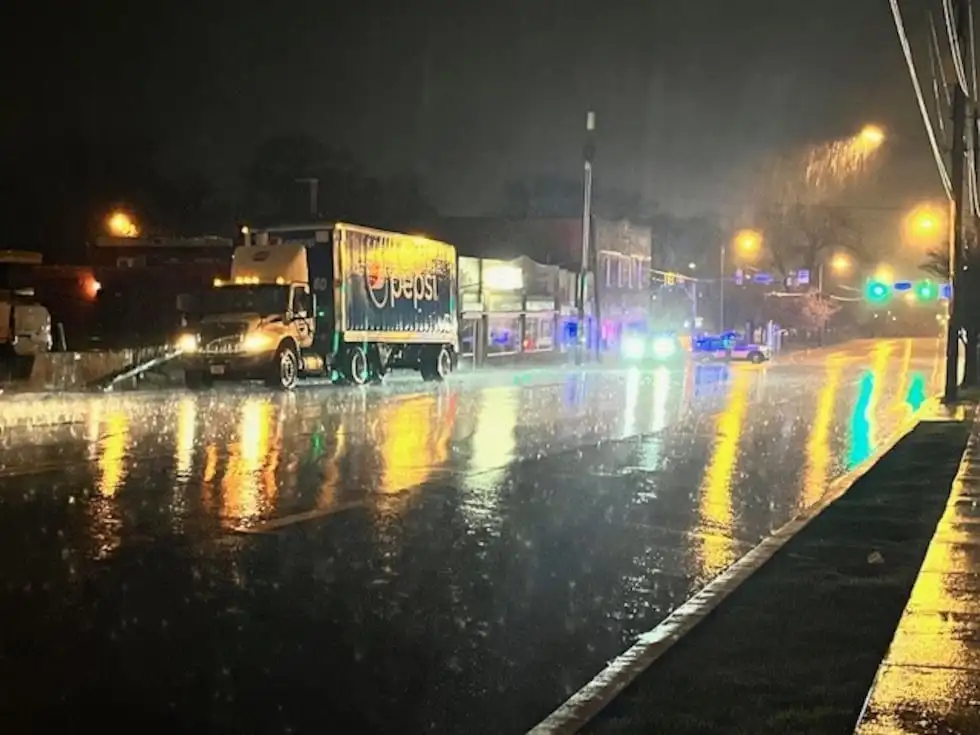 Power lines lay on top of a Pepsi delivery truck on Charlotte Avenue.