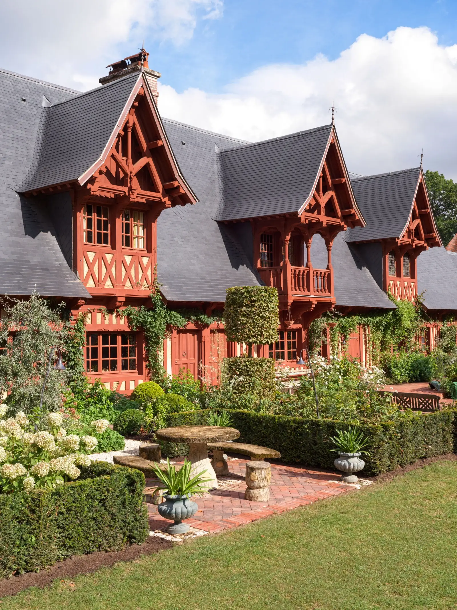 red house with three bay windows