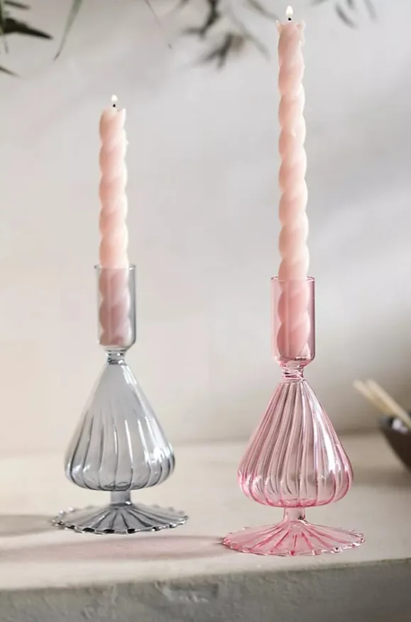 The Anthropologie candle stick holders are available for $24 each