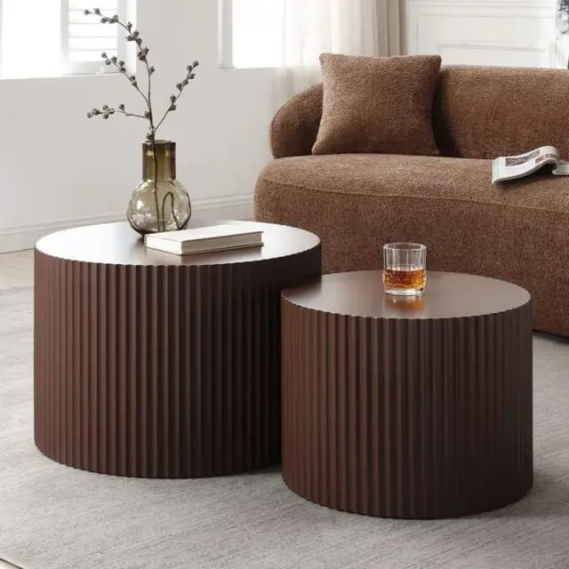 brown drum-shaped nesting coffee tables