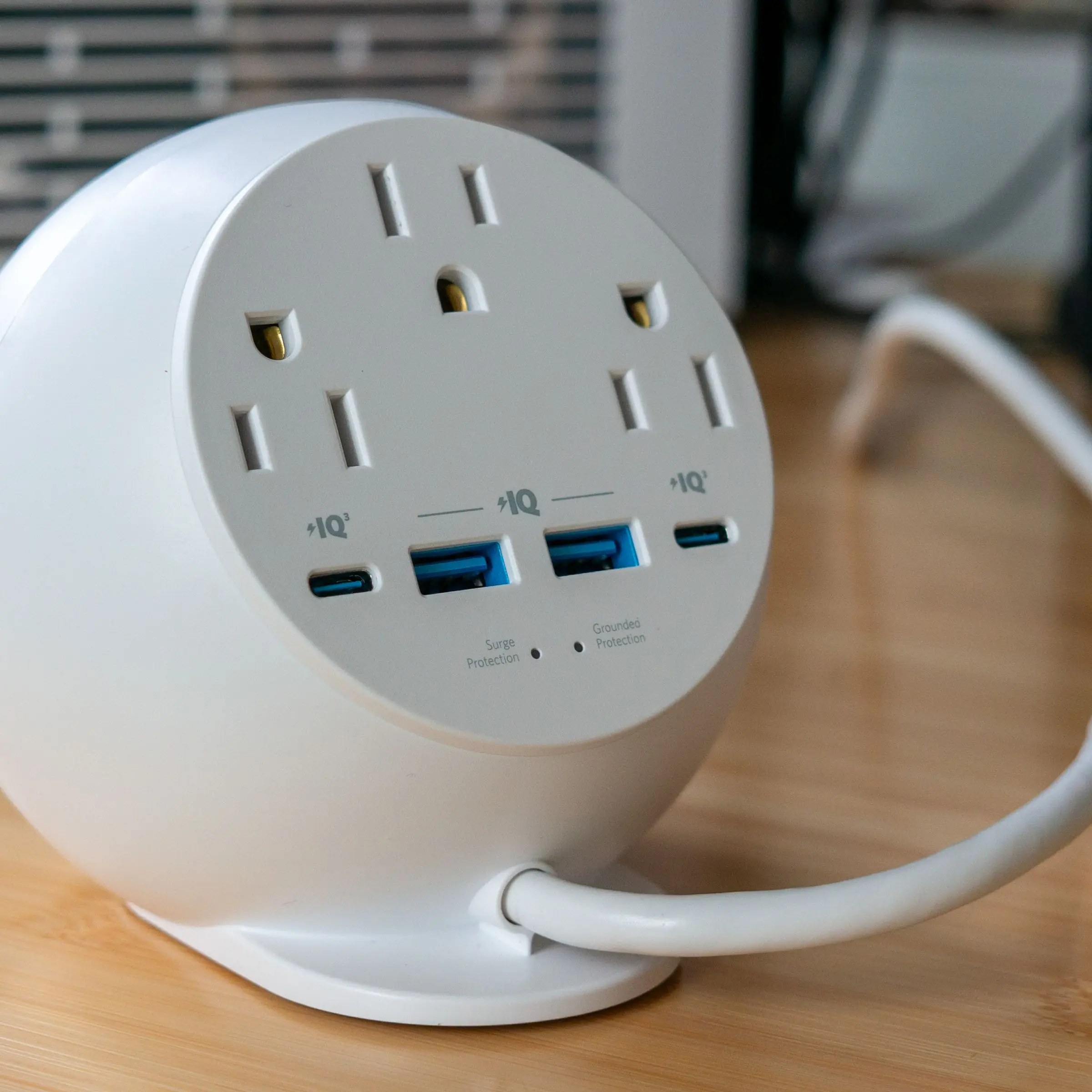 Rear view of the Anker 8-in-1 orb showing three AC outlets, two USB-A, and two USB-C ports.