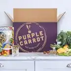 purple carrot meal kit on table next to box