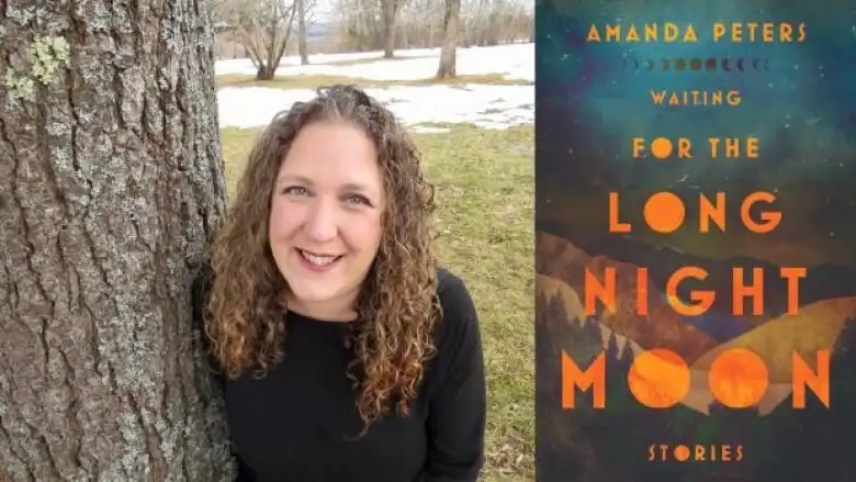 a woman with curly brown hair smiles next to a tree trunk, beside a book cover featuring mountains under a starry night.